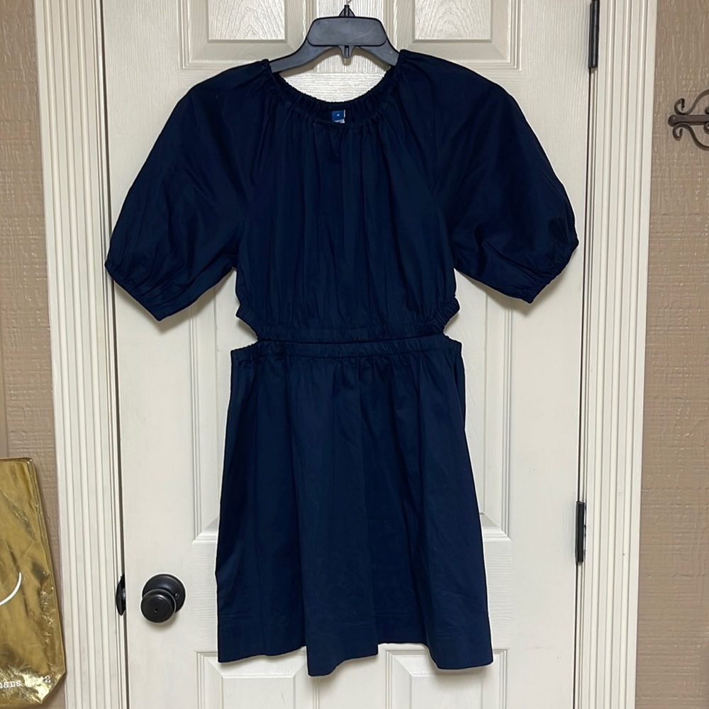 Old Navy dress. Size medium.New! Very cute! Peep holes on the sides.See pictures